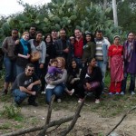 A group of study abroad students in rural Morocco, posing with a family that they have just spent three hours visiting. After a frank and earnest conversation about life in rural Morocco and the students' diversity of experiences in America, sharing a meal together prepared by students and the family, and a bit of cultural exchange through sharing music and dance, this picture serves as a way to remember the experiences of the afternoon and the personal connections with individuals. (Photo courtesy of K. Rosenbaum)