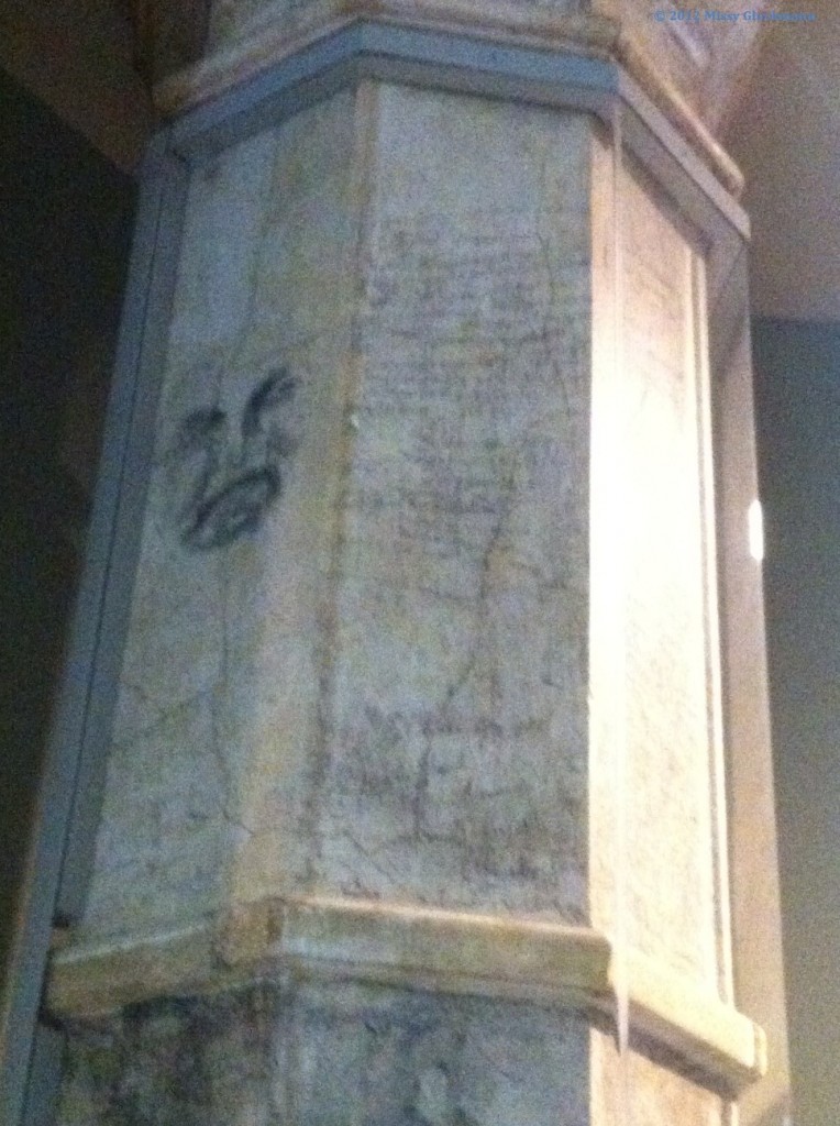 During the long wait in line at Ellis Island, new Americans drew grafitti on the pillars.  I am moved by the image of angst on the upper left of this image.